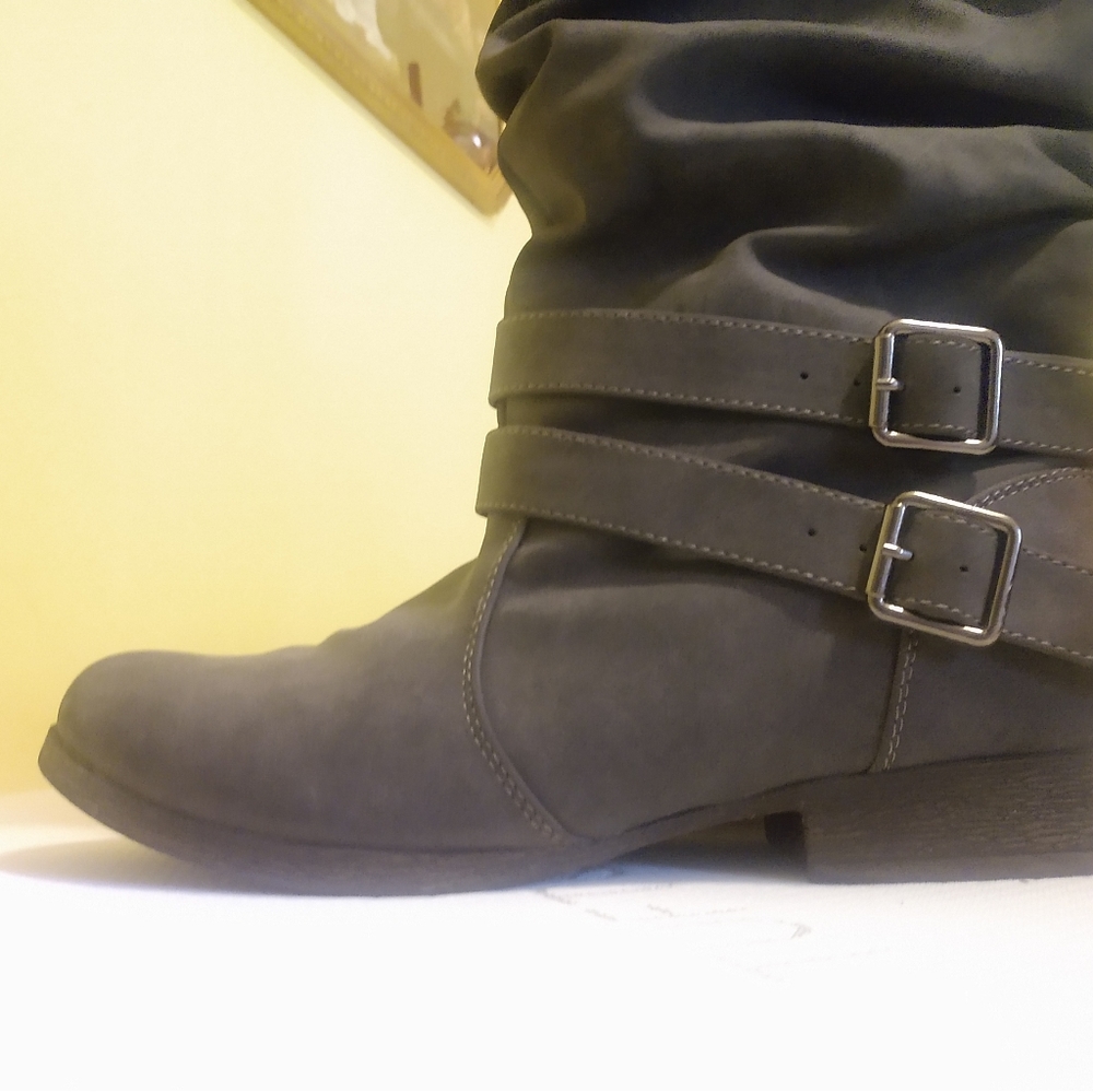 Grey boots with fabric trim.